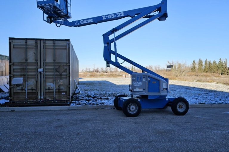 Boom lift with the boom raised in a Manitoba yard, used for boom lift train the trainer courses