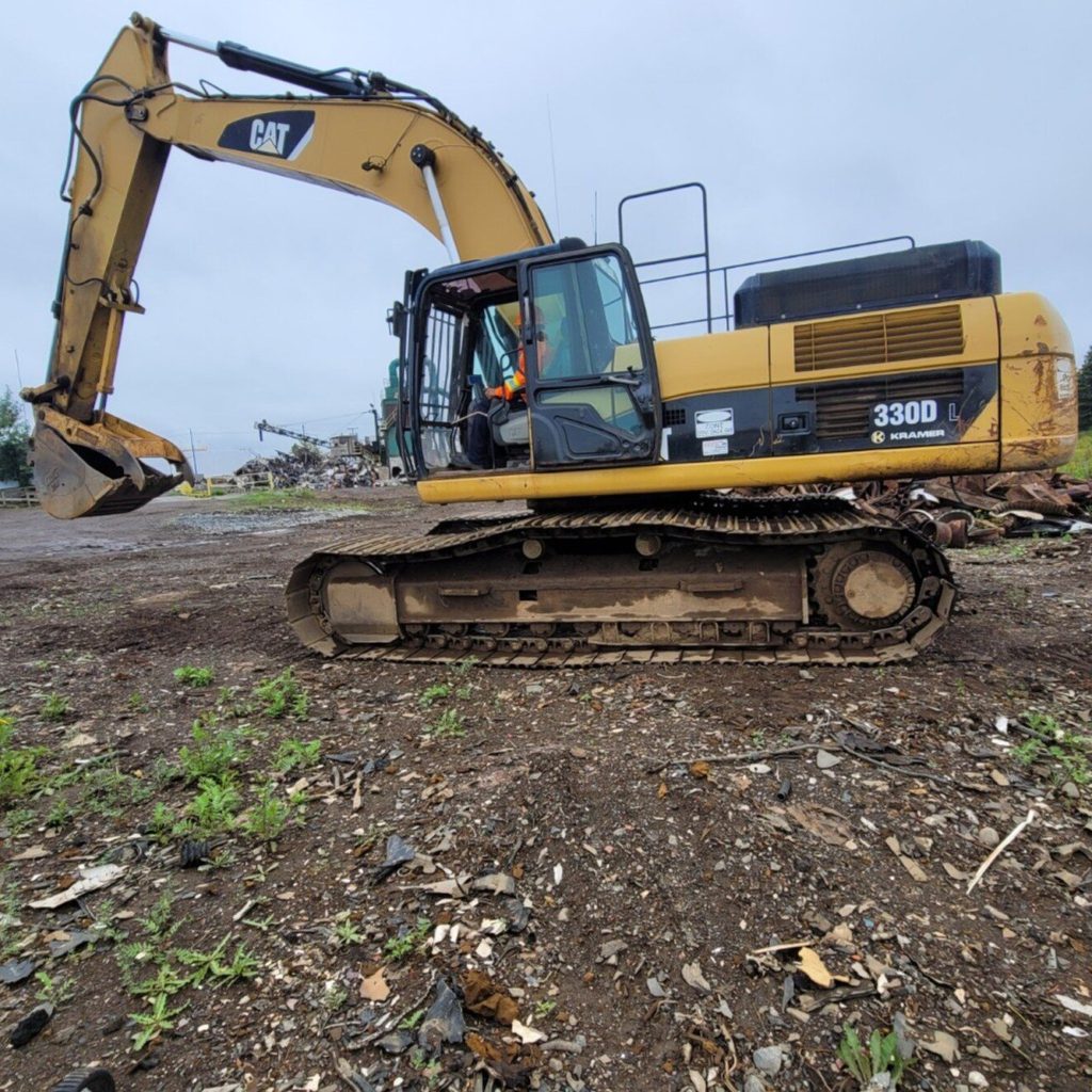 Tracked excavator on a Manitoba site during an excavator train the trainer course