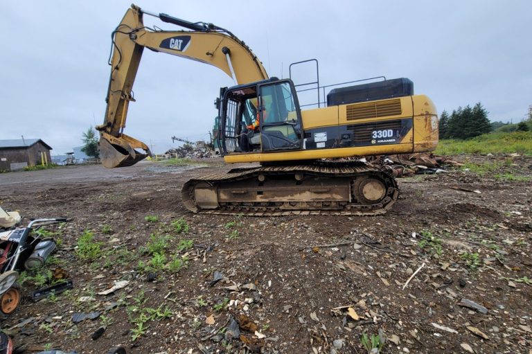 Tracked excavator on a Manitoba site during an excavator train the trainer course