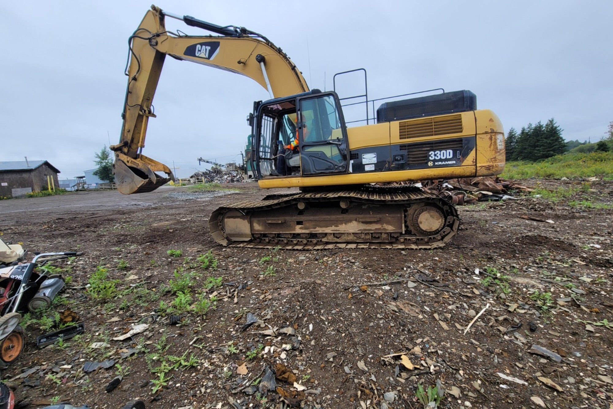 Tracked excavator on a Manitoba site during an excavator train the trainer course