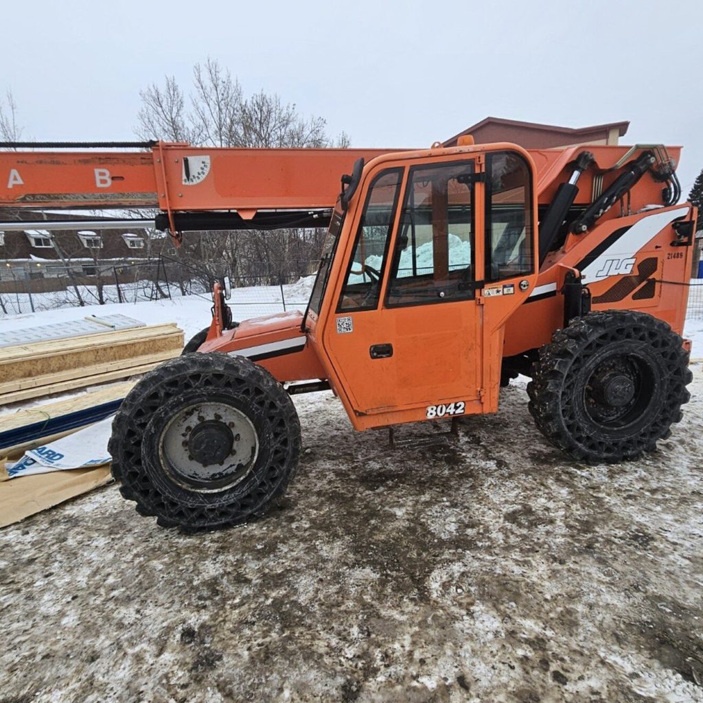 Telehandler parked on a snowy Manitoba worksite during on-site zoom boom operator training