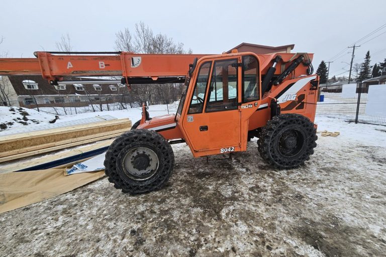 Telehandler parked on a snowy Manitoba worksite during on-site zoom boom operator training
